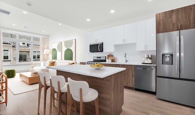 Spacious kitchen with island and bar stools
