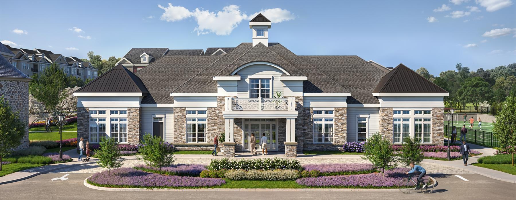 a large building with a lawn and a large garden in front of it